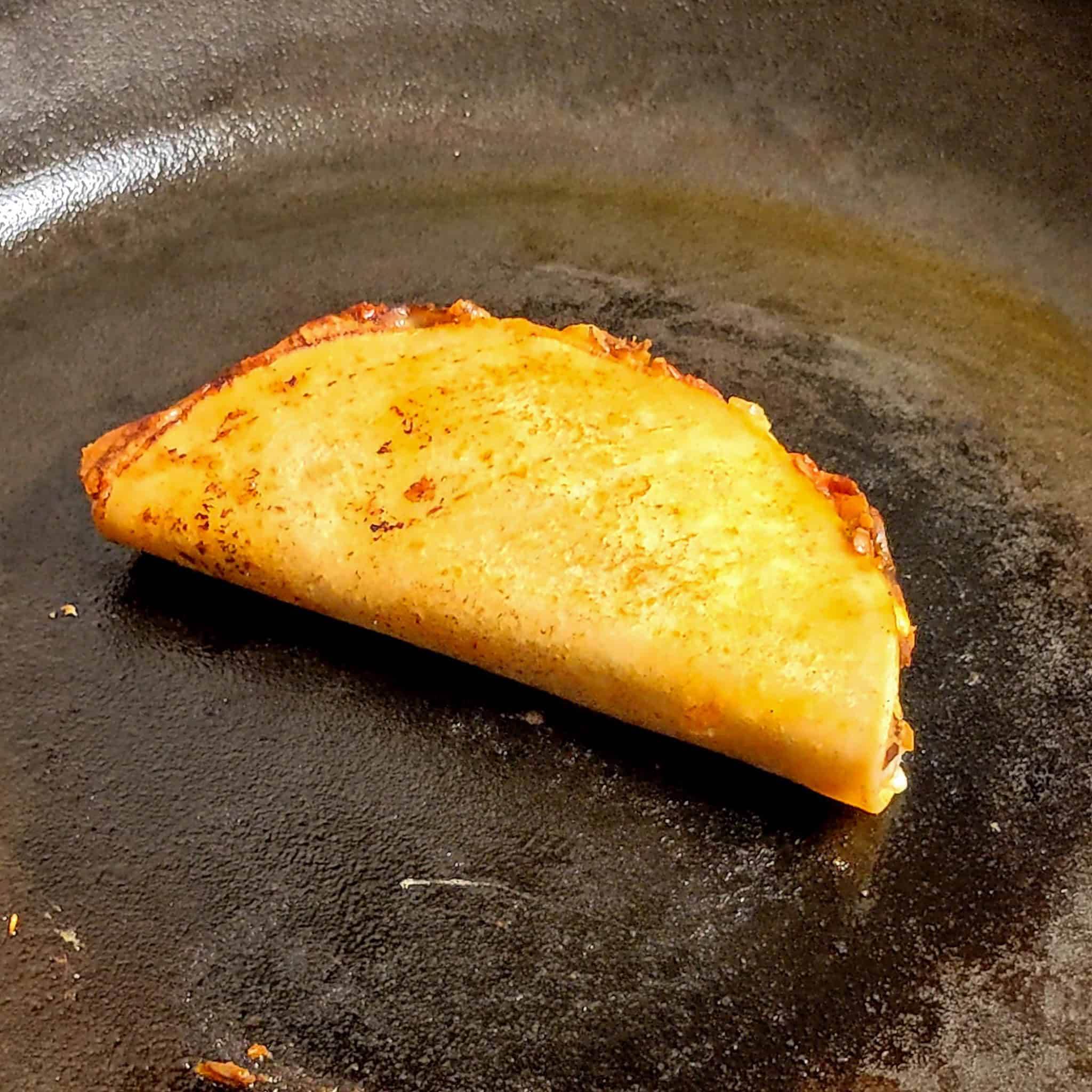 finished Vegetarian Birria Style Taco in a cast iron pan.